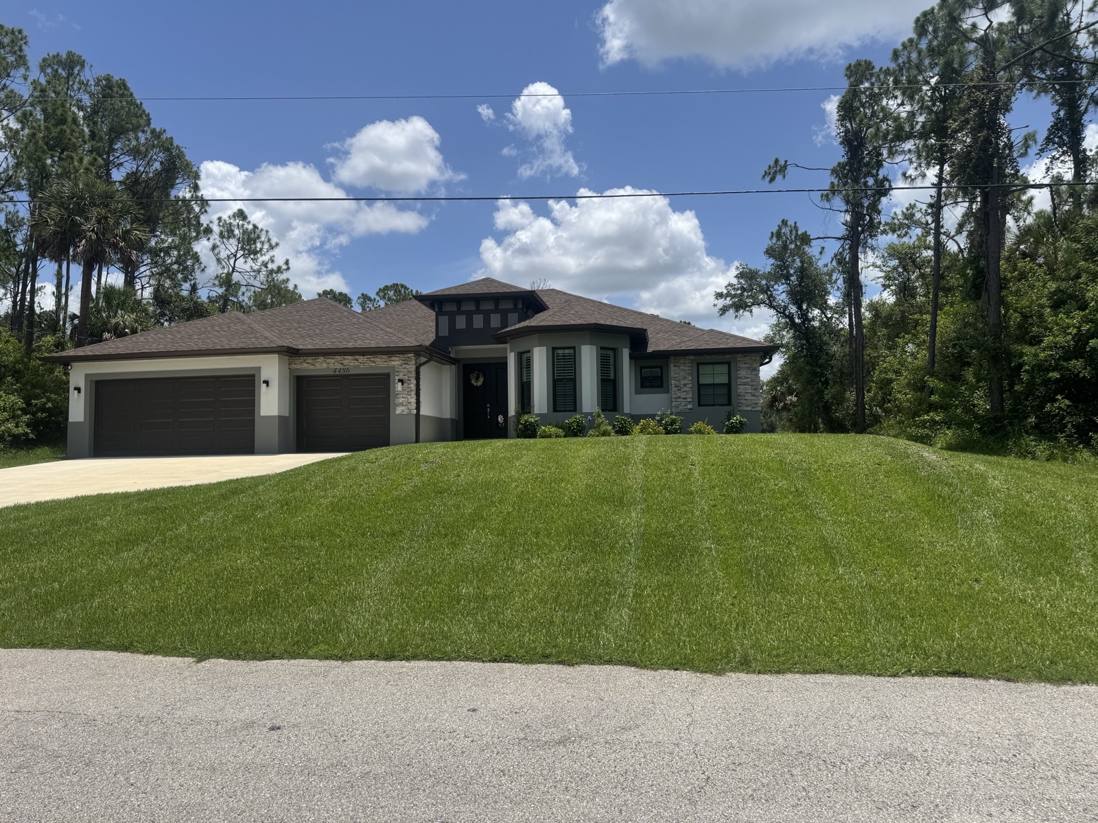 Professional lawn mowing with precision stripes — North Port FL home
